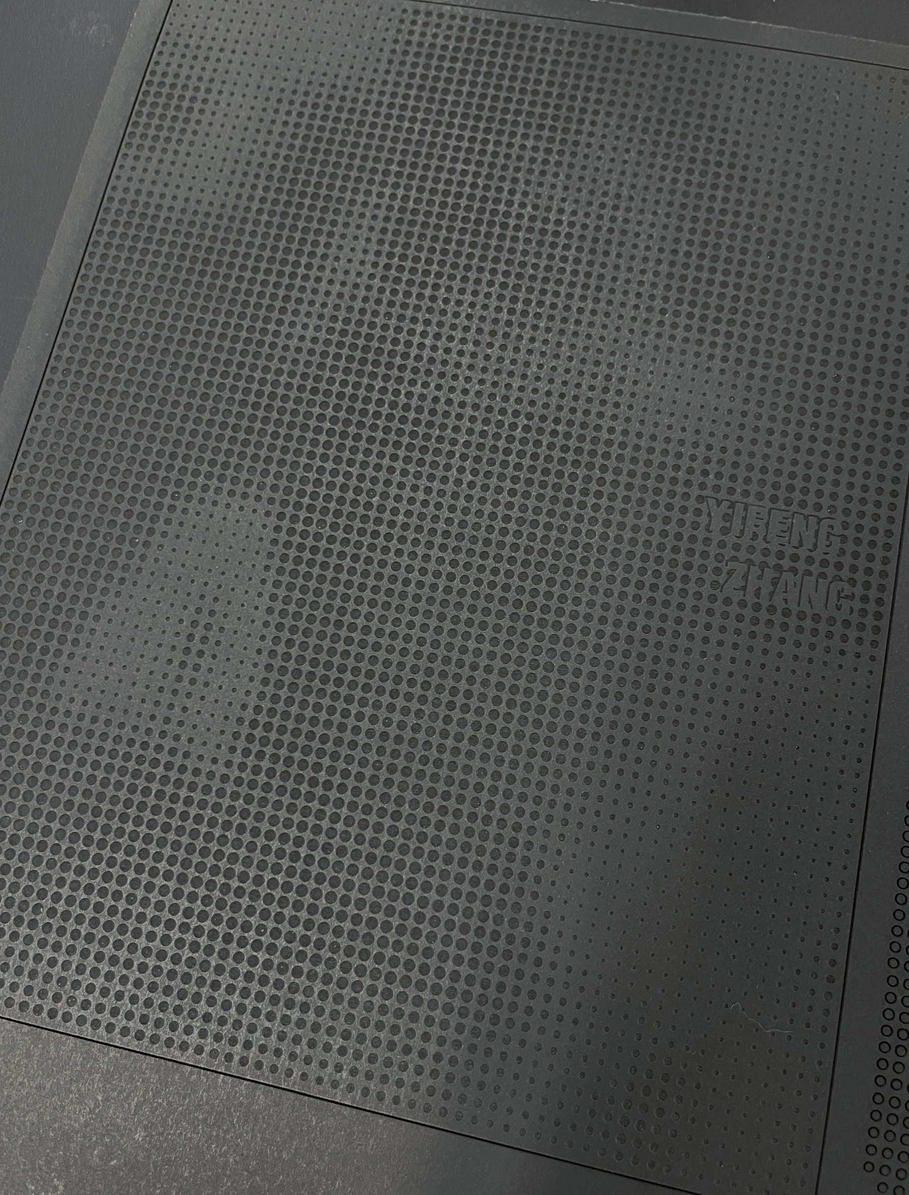 Handmade portfolio cover with laser-cut perforations